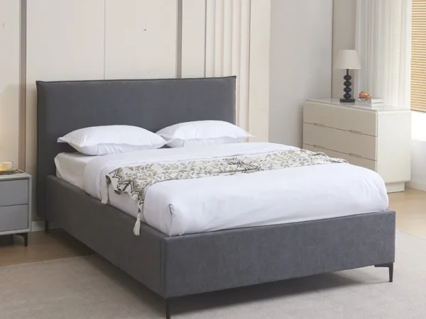 מיטה רחבה לנוער 120×190 מרופדת בד רחיץ עם ארגז מצעים דגם נובה – אפור